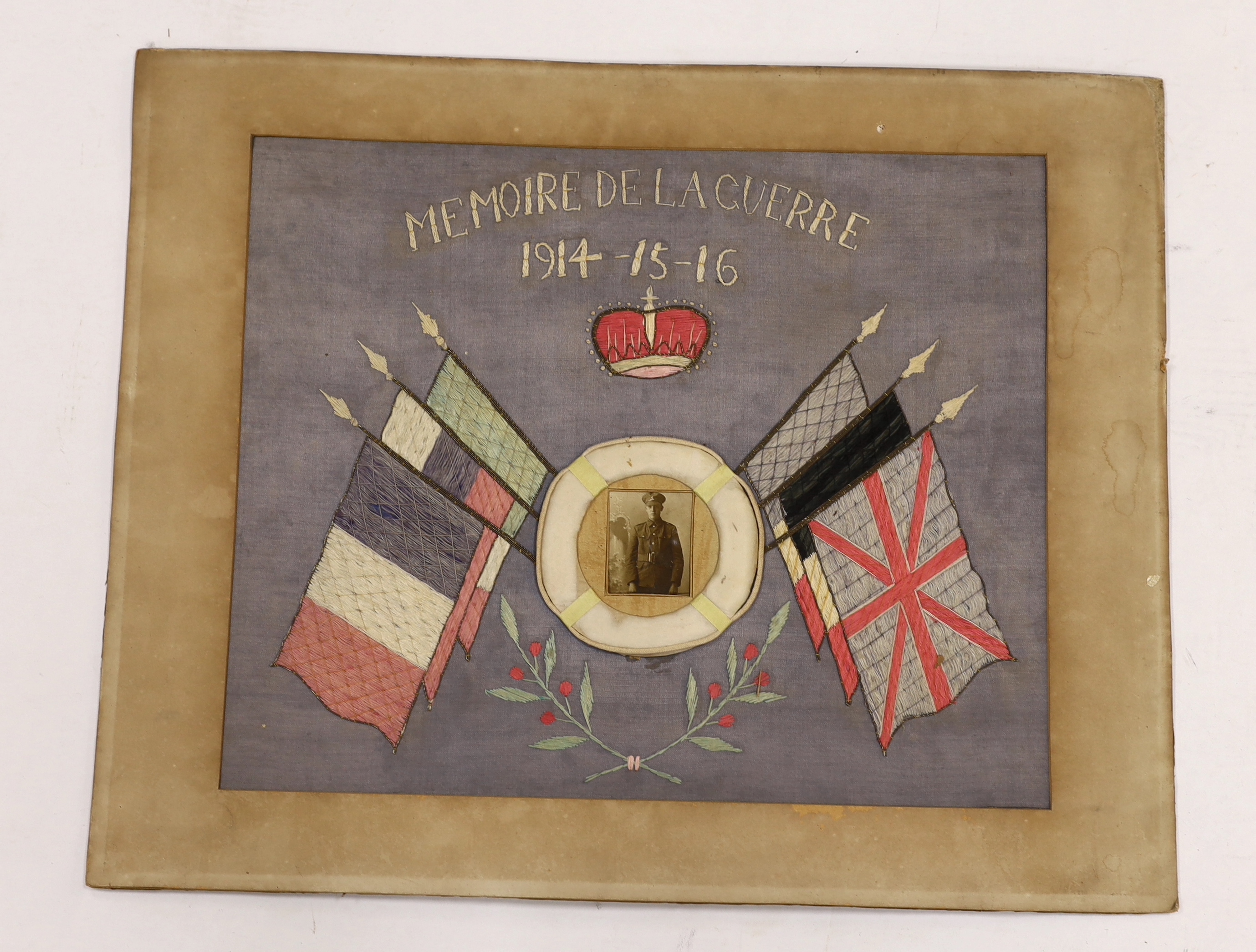 Two First World War souvenir embroideries mounted on boards, one relating to Egypt and another in memory of Laguerre 1914-15-16, both with contemporary photographs of soldiers at the centre, largest 50.5 x 63cm